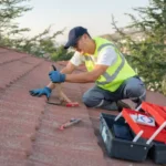 Roofer buider worker ensuring roof maintenance
